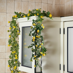 Artificial Yellow Rose Vine Decorating a Bright Kitchen Cabinet