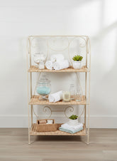 White Wash Metal Wicker Stand with 3 Shelves for Decor being used to display bathroom accessosries.