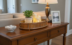 Set of 3 Oval Bamboo Serving Trays with Brass Rings displaying a plant and candles on a sofa table