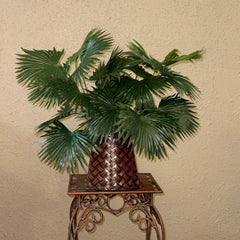Original photograph of the 22-inch artificial Chinese fan palm arrangement with two plants in its basketweave metal container; display stand not included.