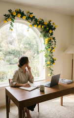 Artificial Silk Rose Bush adding a Touch of Color to a an Arched Window in a Female Office.