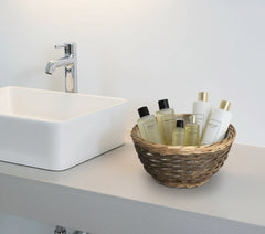 12 inch bakset w plastic liner filled with goodies for guests.