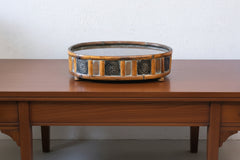 17 inch oval rattan container on an oversized sofa table
