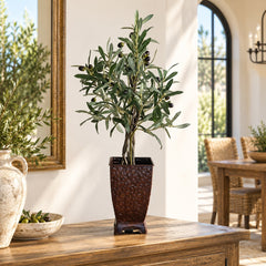 28 inch artificial olive tree on natural wood in a hammered copper container on a dining room console
