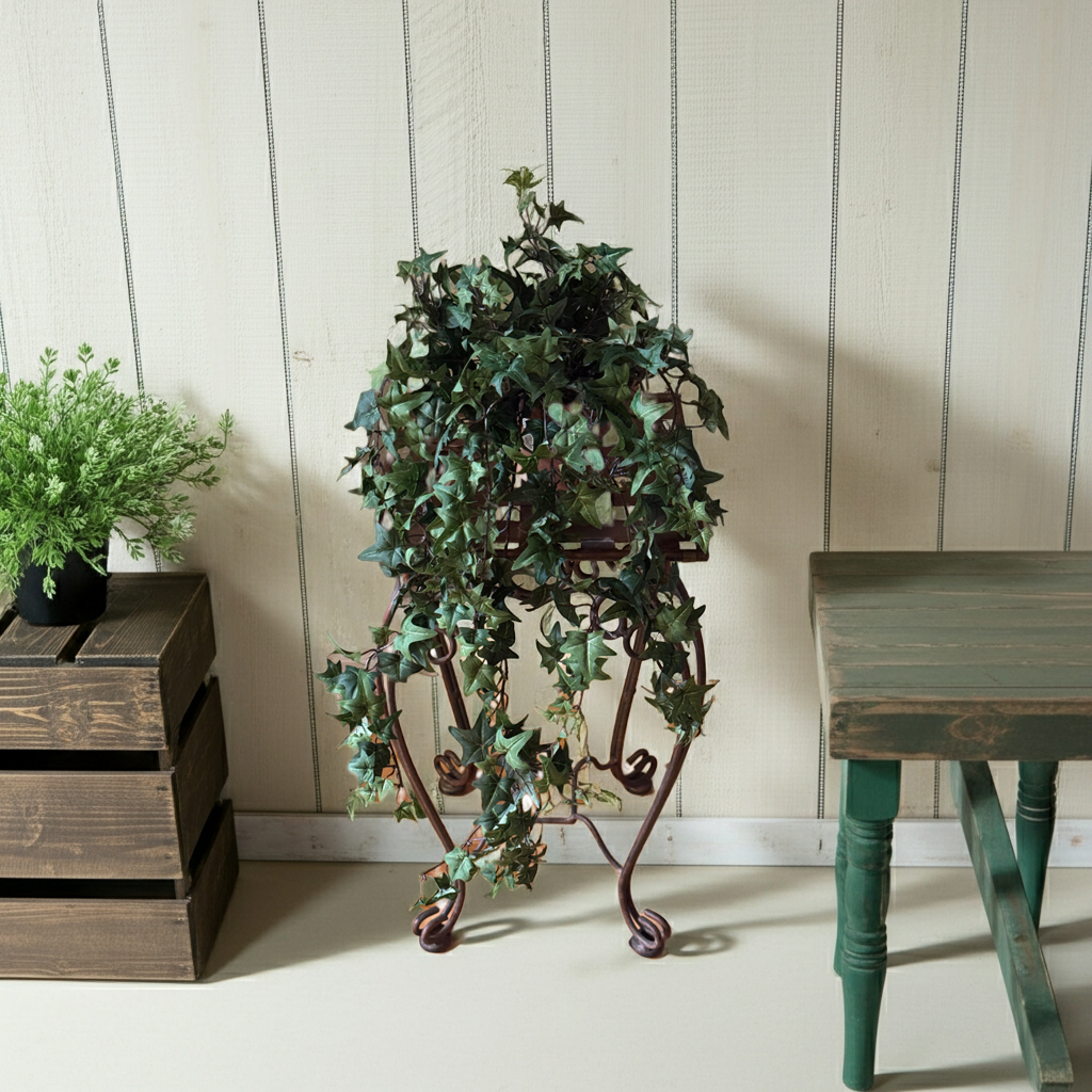 30" Artificial Pittsburgh Mini Leaf Trailing Ivy on a copper plant stand in a rustic country setting.