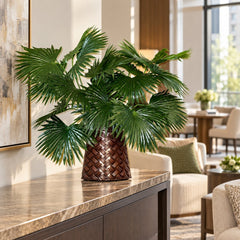 22-inch artificial Chinese fan palm arrangement in its basketweave metal container on a condo residents’ lounge console.